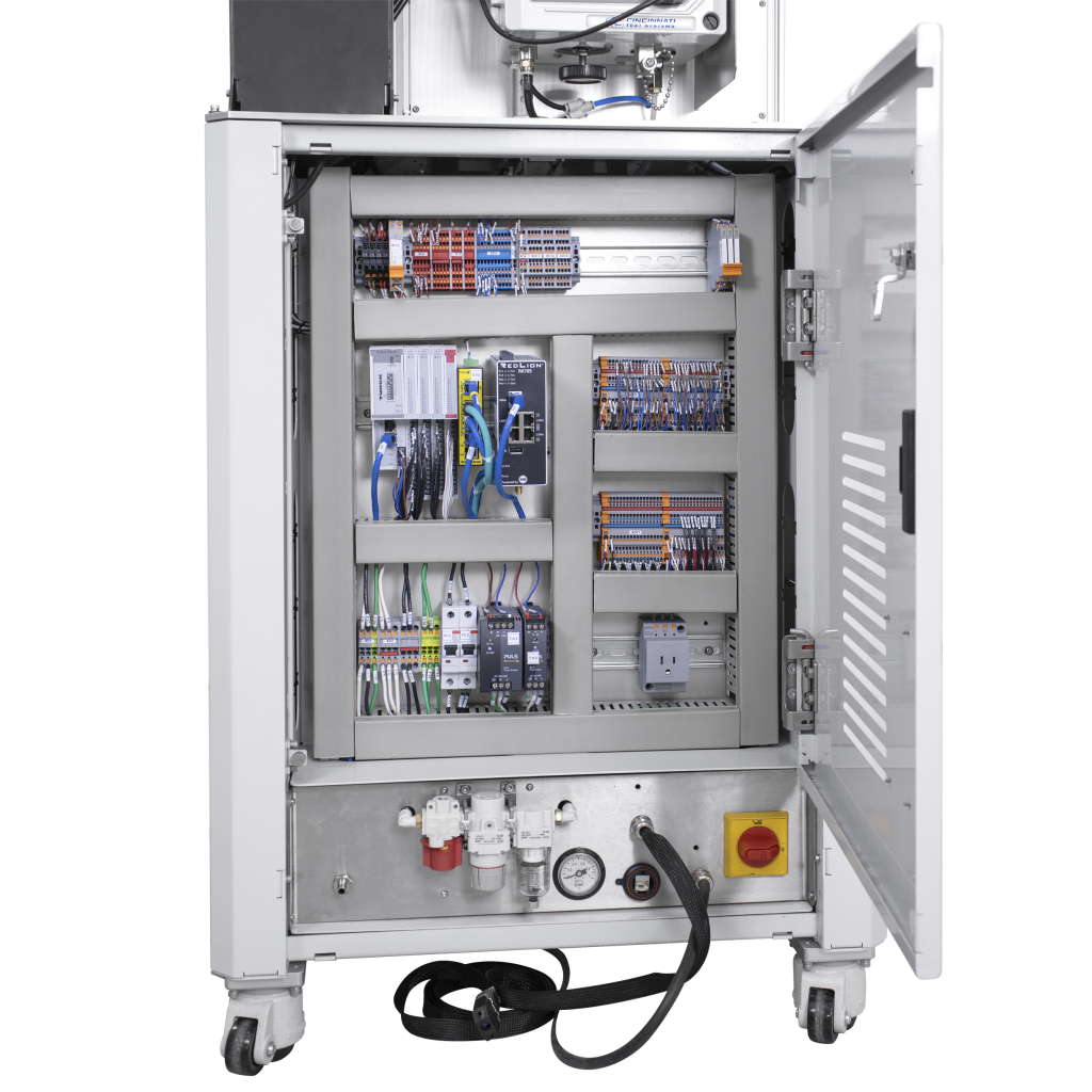 Vectralis electrical control panel inside automotive leak tester, showing industrial wiring and configuration