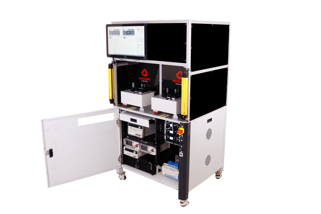 Vectralis testing station with instrumentation cabinet open, showing internal systems for power and USB diagnostics