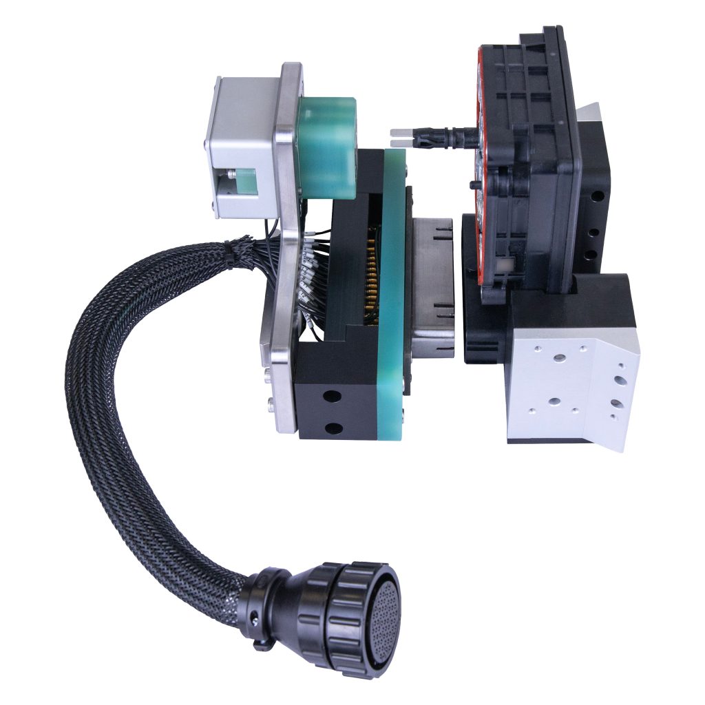 Vectralis setup with test nest and harness for accurate pin presence verification