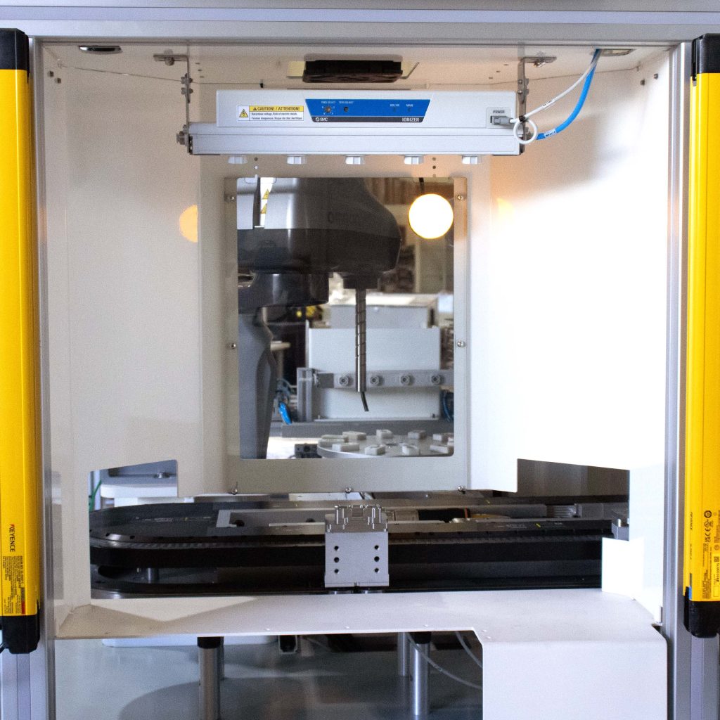 Load and unload process of integrated custom assembly station for automotive electronics
