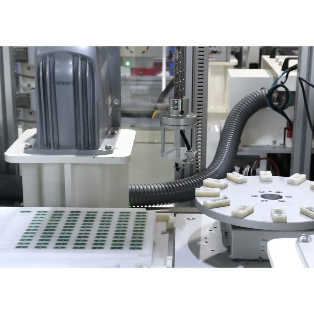 Robotic pick-and-place process within integrated custom assembly station