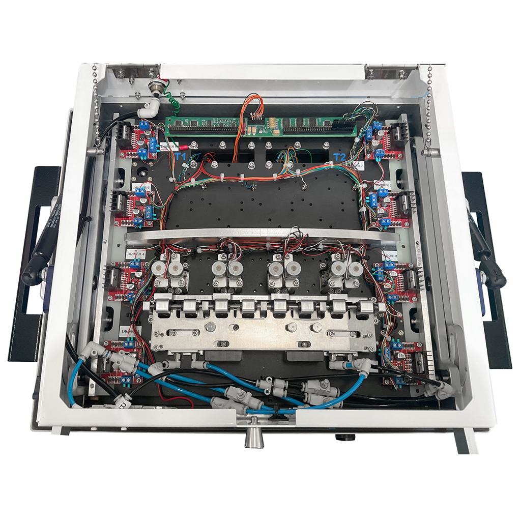 Top access open on Vectralis fixture, revealing instrumentation and functional test mechanisms, including actuators and communication interfaces.
